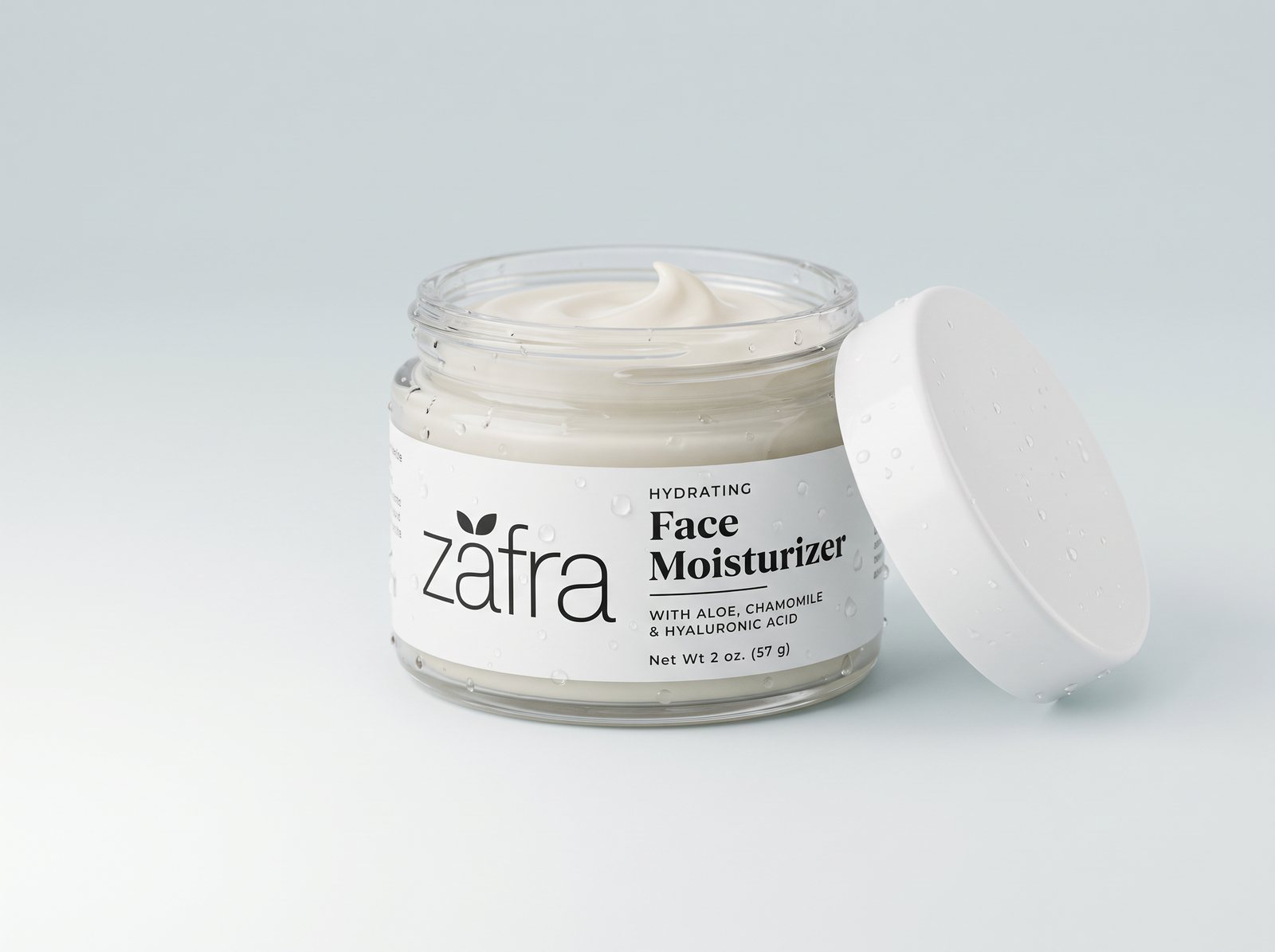 Zafra Hydrating Face Moisturizer jar, open, with cream and water droplets